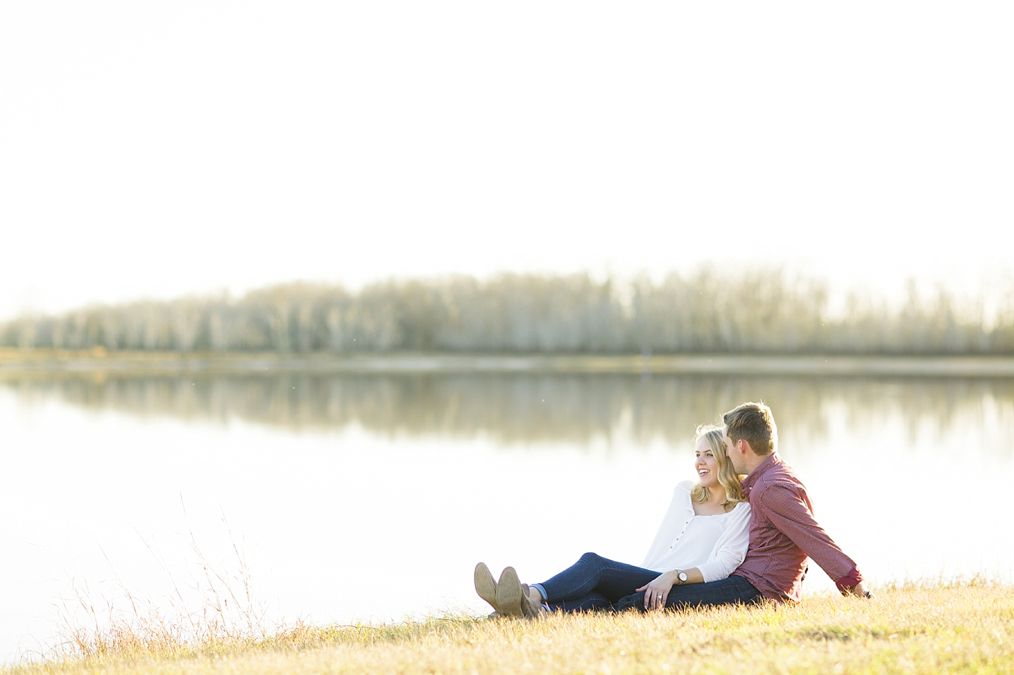 young couple relaxing by water