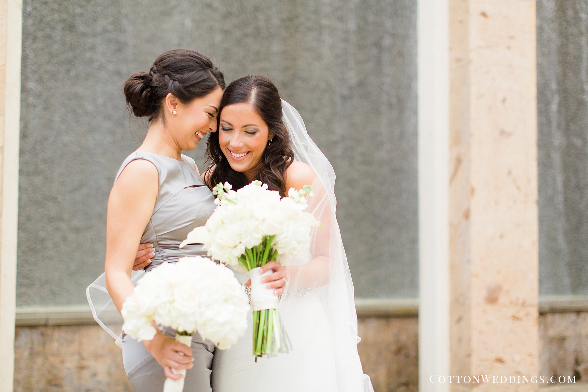sweet photo of bride with friend hugging