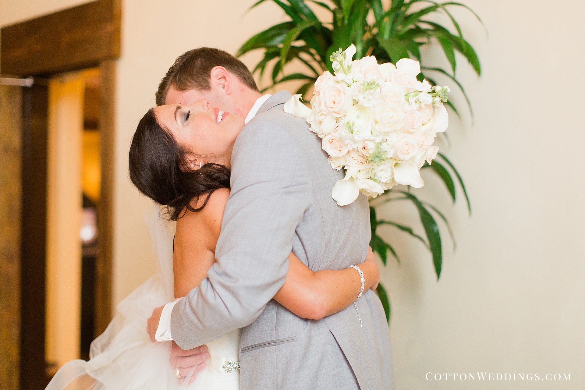 bride and groom embrace after ceremony