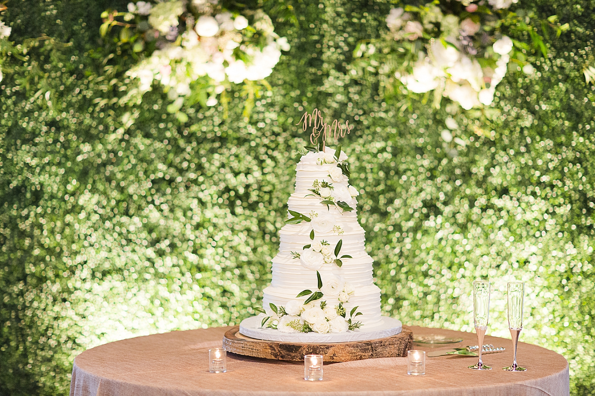 cake table with flower wall