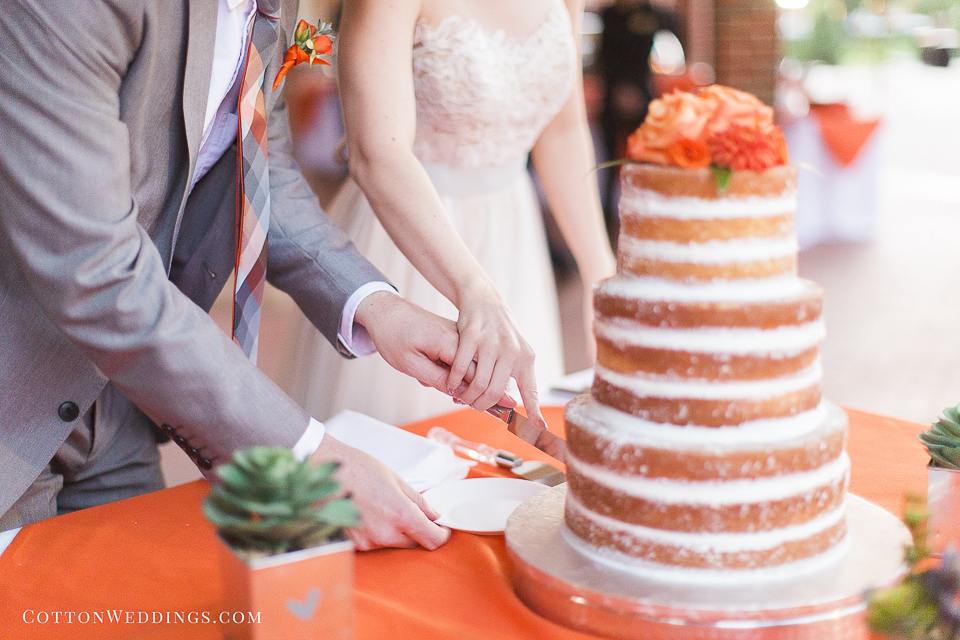bride groom cutting cake orange