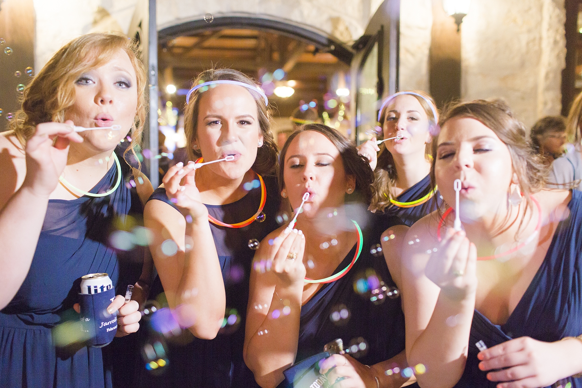 bridesmaids blowing bubbles