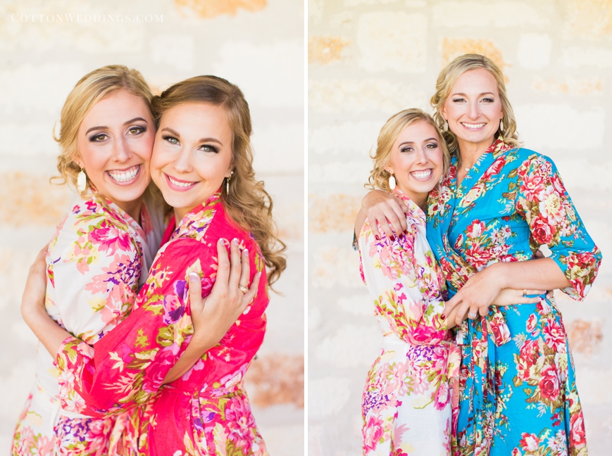 bride hugging bridesmaids in floral robes