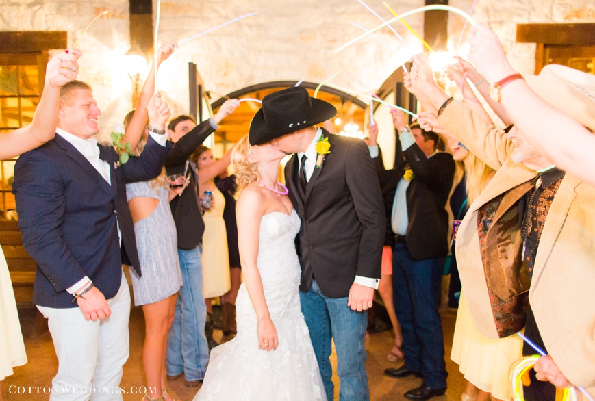 bride and groom kiss glow stick exit