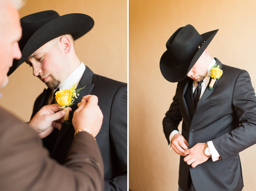 country groom putting on jacket