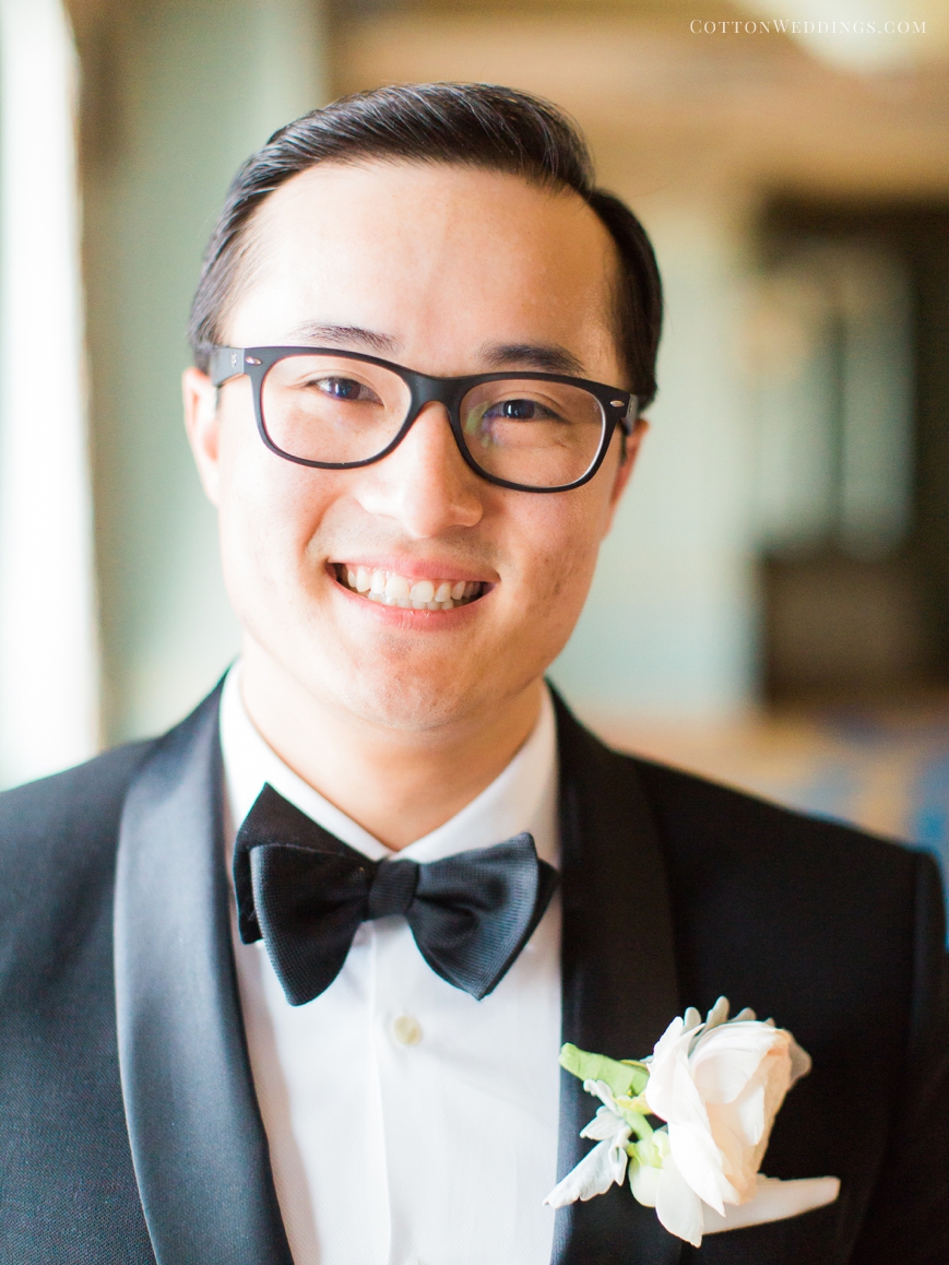 adorable asian groom with bowtie