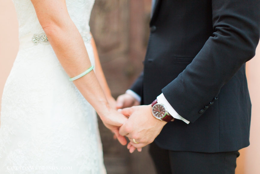 bride and groom holding hands with gifts
