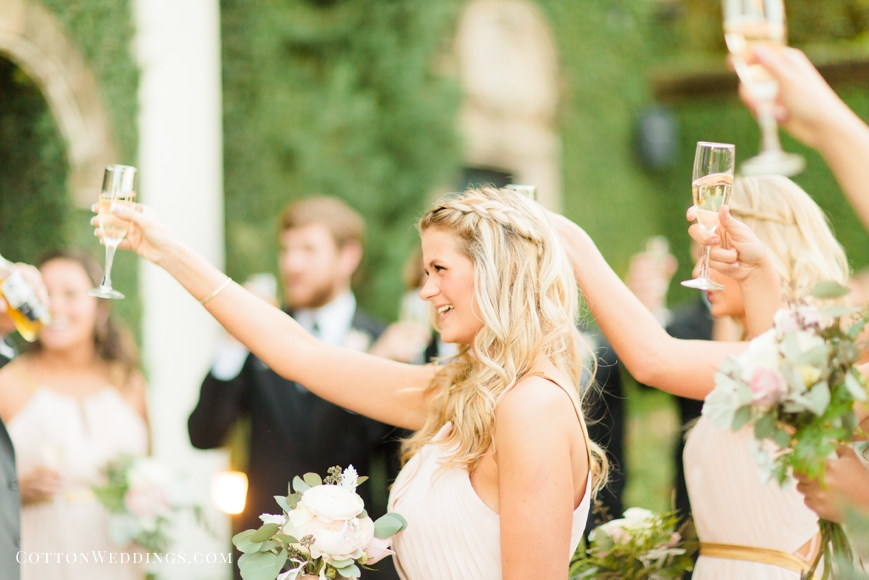 bridesmaids cheers with champagne after ceremony