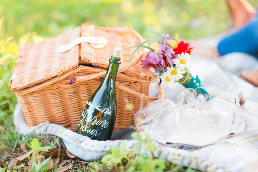 engagement session with picnic basket and flowers
