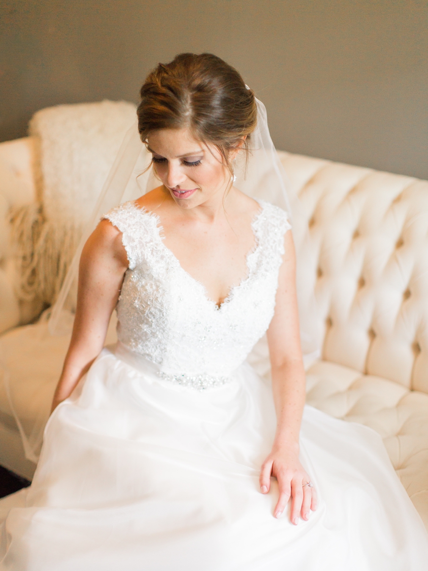 portrait of bride on cream couch