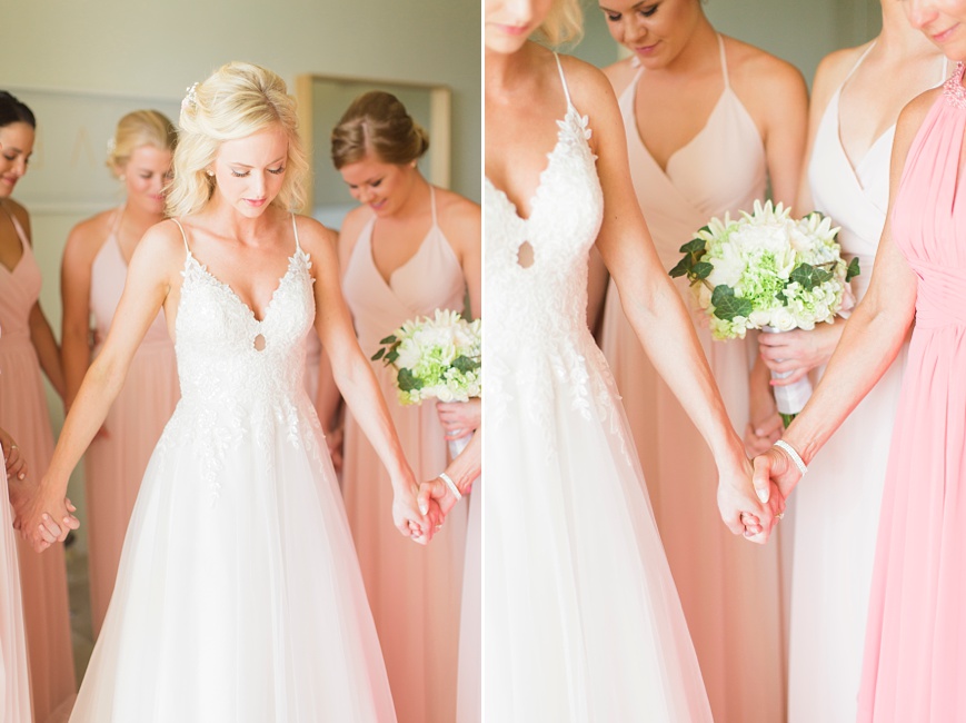 bride praying with bridal party before ceremony