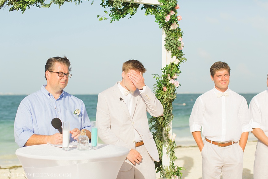 groom crying beach wedding