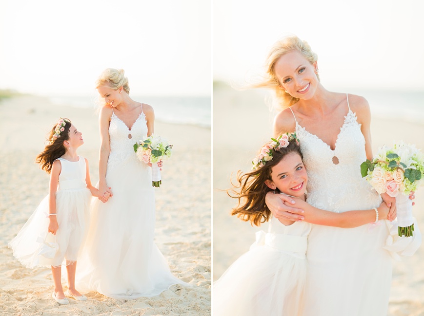 beautiful bride with flower girl on beach