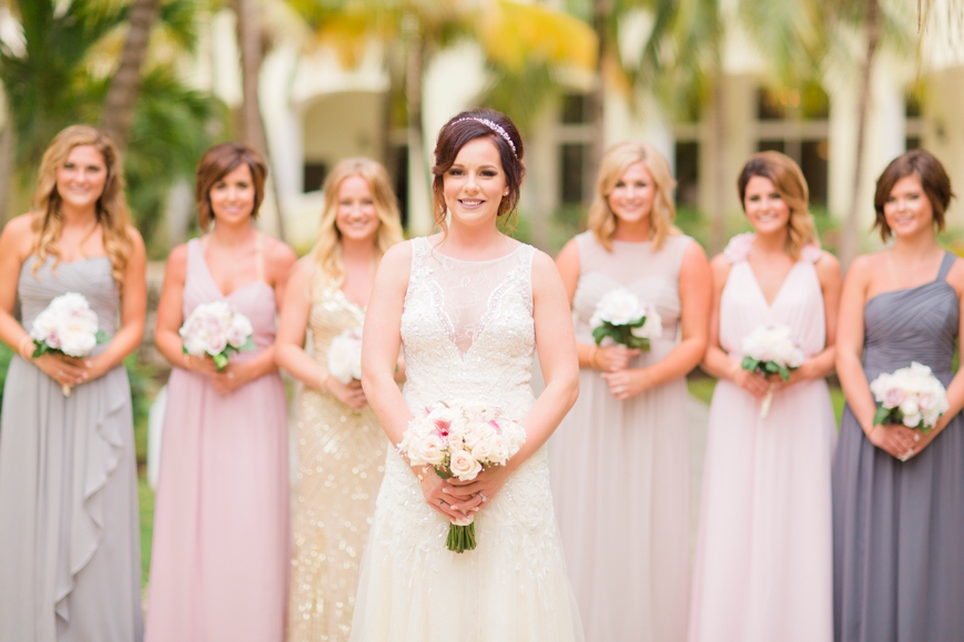beautiful bride with bridesmaids blush tones
