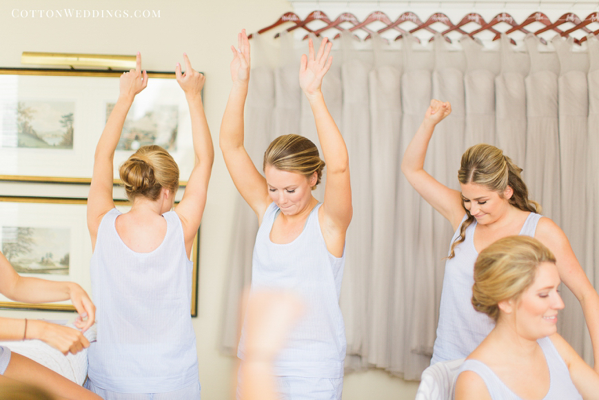 bridesmaids dancing in getting ready outfit