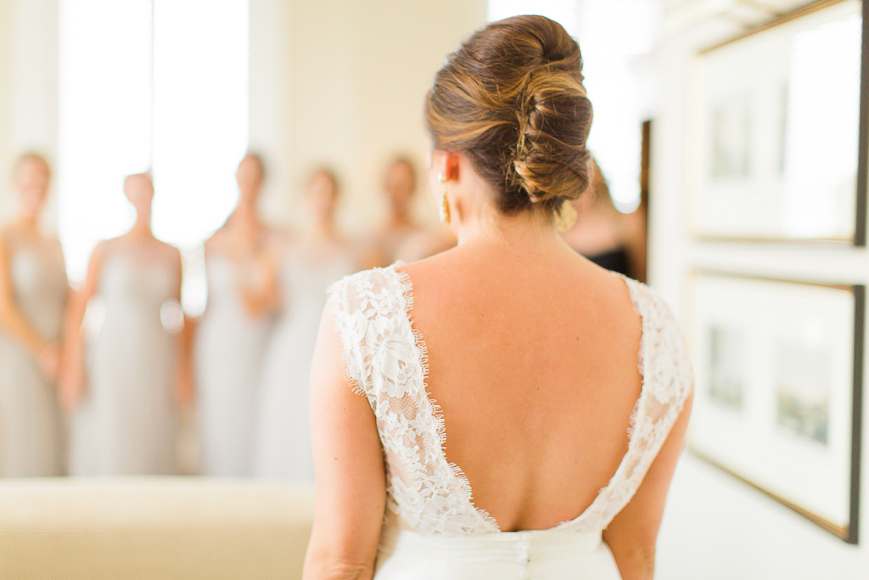 photo of bride looking at all of her bridesmaids