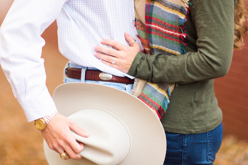 couple kissing cowboy hat