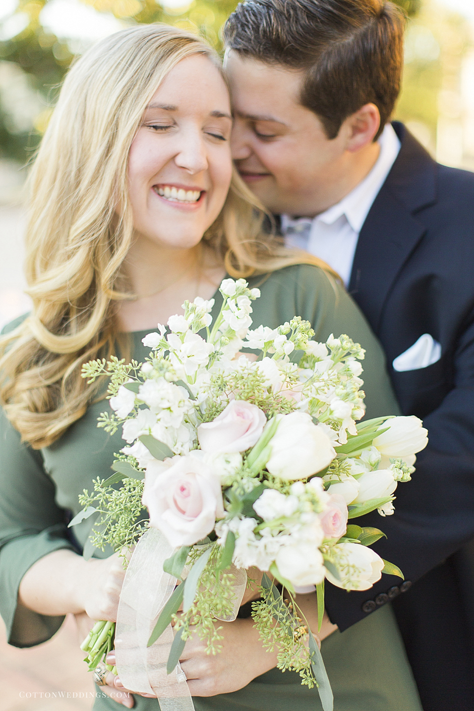 happy couple with floral bouquet