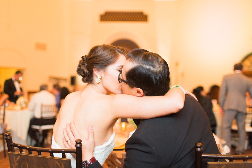 bride groom kissing during reception parador