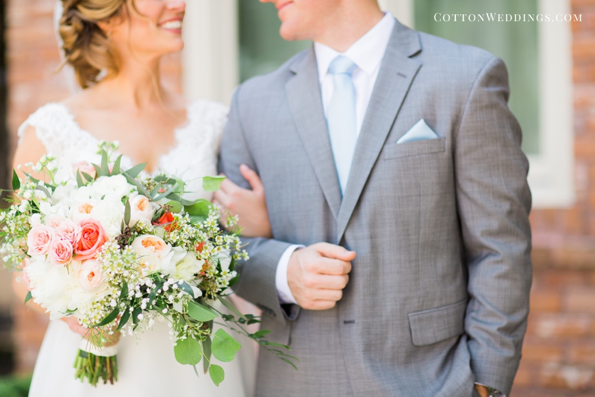 detail of bride and groom grey suit