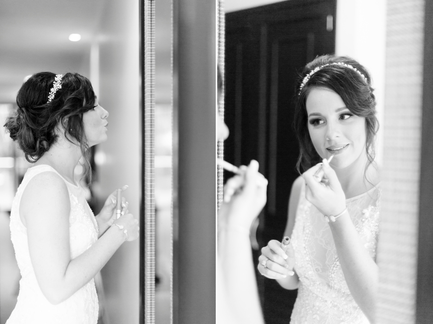 bride putting on lipstick in mirror cute