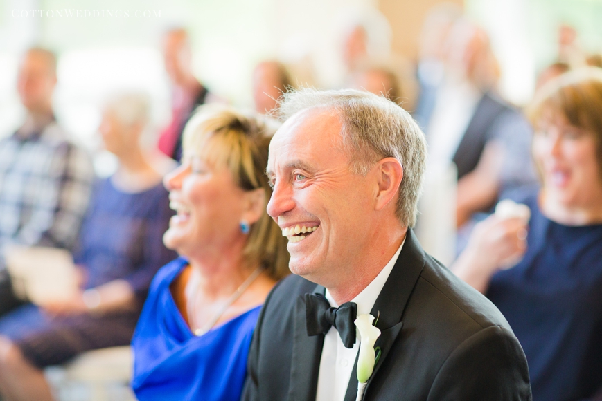 mom and dad laughing during ceremony